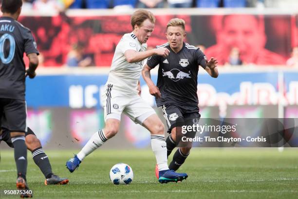 Dax McCarty of Chicago Fire challenged by Marc Rzatkowski of New York Red Bulls during the New York Red Bulls Vs Chicago Fire MLS regular season game...