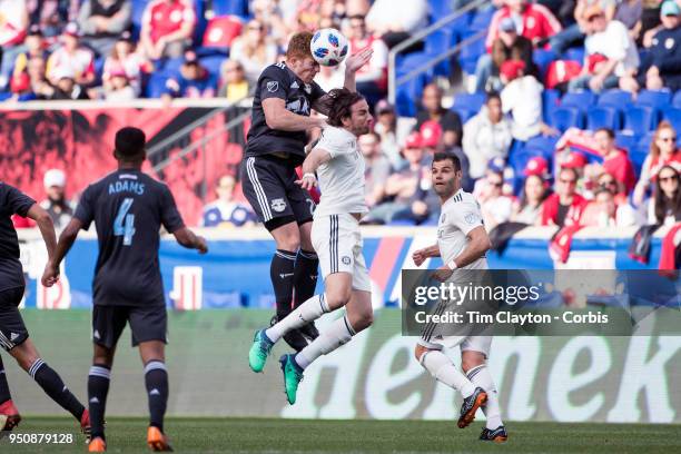 Tim Parker of New York Red Bulls and Alan Gordon of Chicago Fire challenge for the ball during the New York Red Bulls Vs Chicago Fire MLS regular...