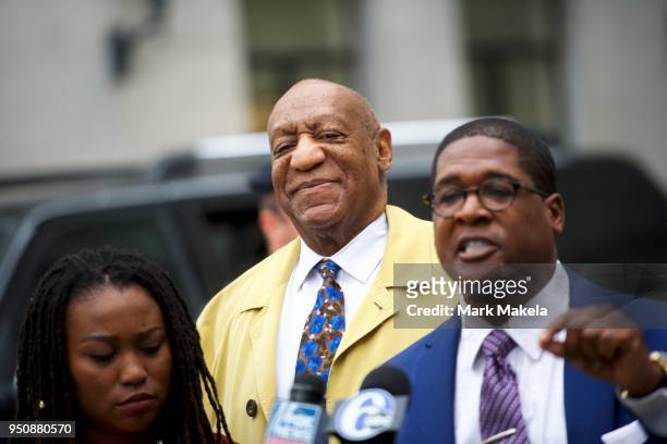 Bill Cosby reacts as his publicist, Andrew Wyatt, address the media upon departing the Montgomery County Courthouse after the twelfth day of his...