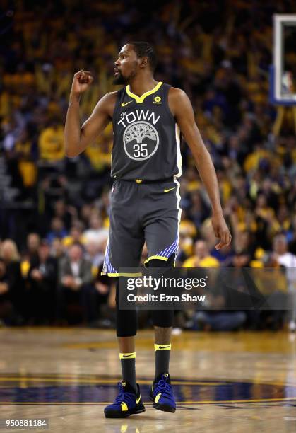 Kevin Durant of the Golden State Warriors reacts during their game against the San Antonio Spurs during Game 2 of Round 1 of the 2018 NBA Playoffs at...