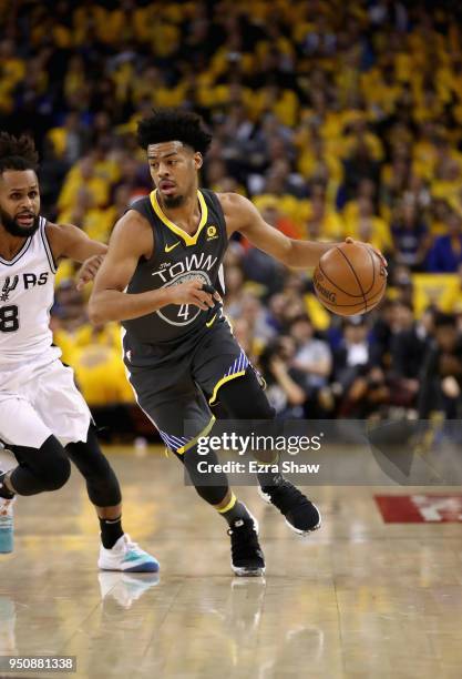 Quinn Cook of the Golden State Warriors in action against the San Antonio Spurs during Game 2 of Round 1 of the 2018 NBA Playoffs at ORACLE Arena on...