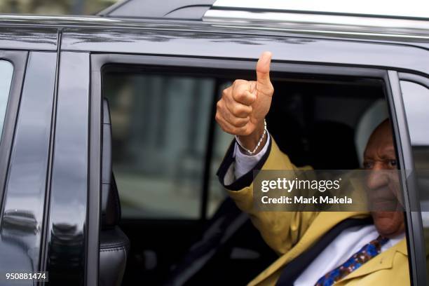 Bill Cosby gives a thumbs up sign while departing the Montgomery County Courthouse after the twelfth day of his sexual assault retrial on April 24,...
