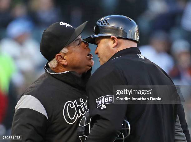 Manager Rick Renteria of the Chicago White Sox argues with home plate umpire Mike Estabrook after being thrown out of the game against the Seattle...