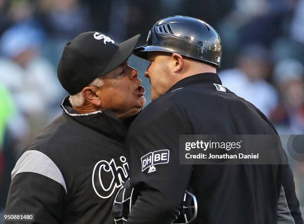 Manager Rick Renteria of the Chicago White Sox argues with home plate umpire Mike Estabrook after being thrown out of the game against the Seattle...