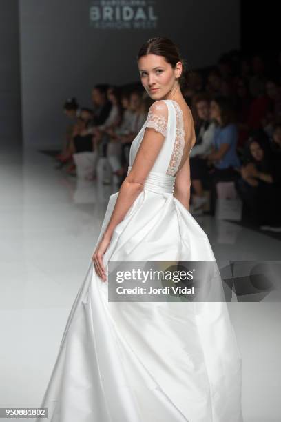 Model walks the runway for the Cristina Tamborero collection during Barcelona Bridal Fashion Week at Fira de Barcelona on April 24, 2018 in...