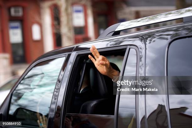 Bill Cosby gives the Ok sign while departing the Montgomery County Courthouse after the twelfth day of his sexual assault retrial on April 24, 2018...