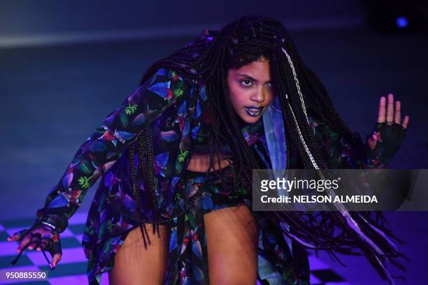 Performer presents a creation by Memo e Isolda during the Sao Paulo Fashion Week in Sao Paulo, Brazil on April 24, 2018.