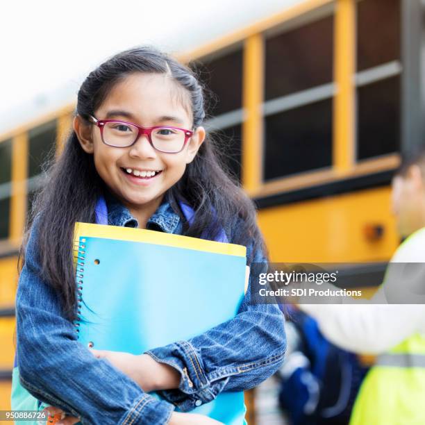 adorable girl is excited about the first day of school - filipino girl stock pictures, royalty-free photos & images