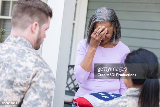 grieving mother mourns death of military son - old lady crying out for help stock pictures, royalty-free photos & images