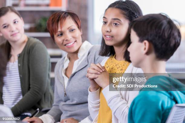 school counselor facilitates discussion group - child psychologist stock pictures, royalty-free photos & images
