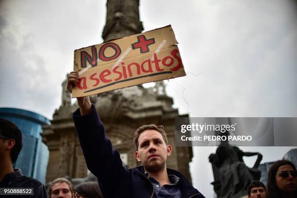 Mexican students take part in a protest against the violence in Mexico and the murder of three students from the University of Audiovisual Media of...