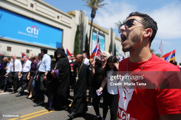Demonstrators march towards the Turkish Consulate during a rally commemorating the 103rd anniversary of the Armenian genocide on April 24, 2018 in...