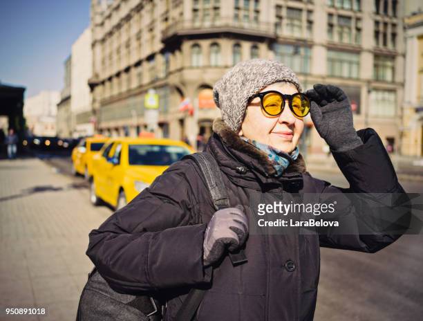 Senior tourist woman on the street