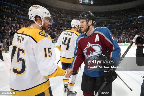 Craig Smith of the Nashville Predators shakes hands with Nathan MacKinnon of the Colorado Avalanche after Game Six of the Western Conference First...