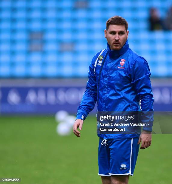 Lincoln City's lead sports scientist Luke Jelly during the pre-match warm-up prior to the Sky Bet League Two match between Coventry City and Lincoln...