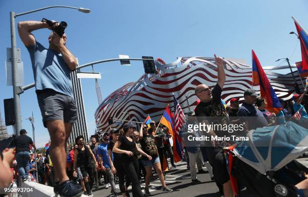 Demonstrators march towards the Turkish Consulate during a march and rally commemorating the 103rd anniversary of the Armenian genocide on April 24,...