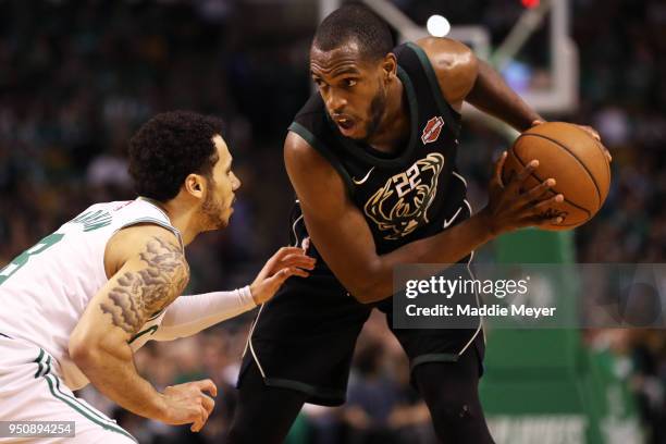 Shane Larkin of the Boston Celtics defends Khris Middleton of the Milwaukee Bucks during the second quarter of Game Five in Round One of the 2018 NBA...