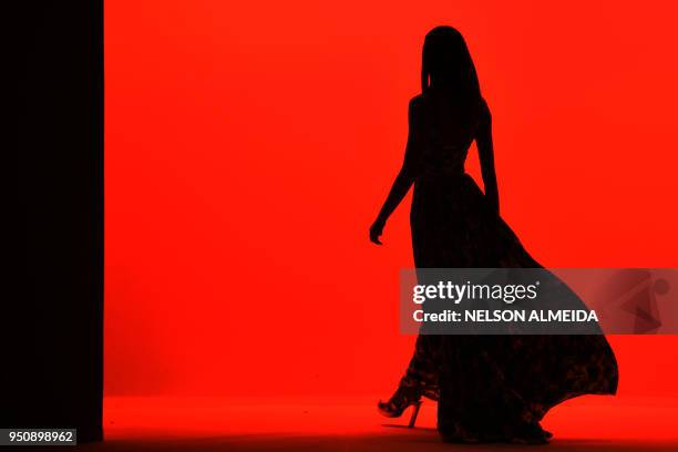 Model presents a creation by Amir Slama during the Sao Paulo Fashion Week in Sao Paulo, Brazil on April 24, 2018.