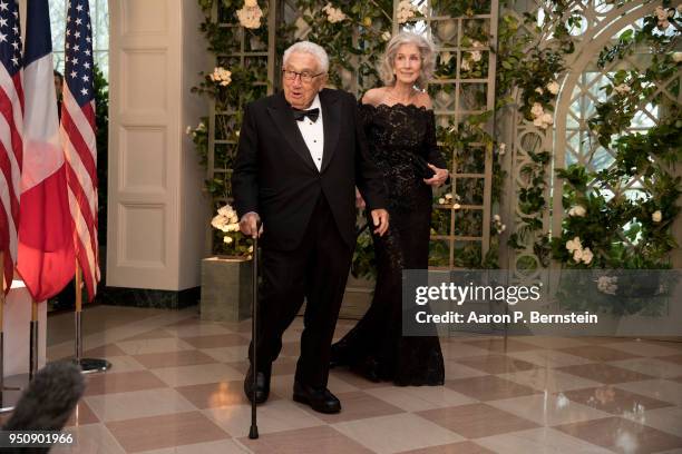 Former Secretary of State Henry Kissinger and his wife Nancy arrive at the White House for a state dinner April 24, 2018 in Washington, DC ....