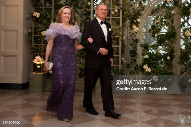 April 24: Chief Justice of the Supreme Court John Roberts and his wife Jane arrive at the White House for a state dinner April 24, 2018 in...