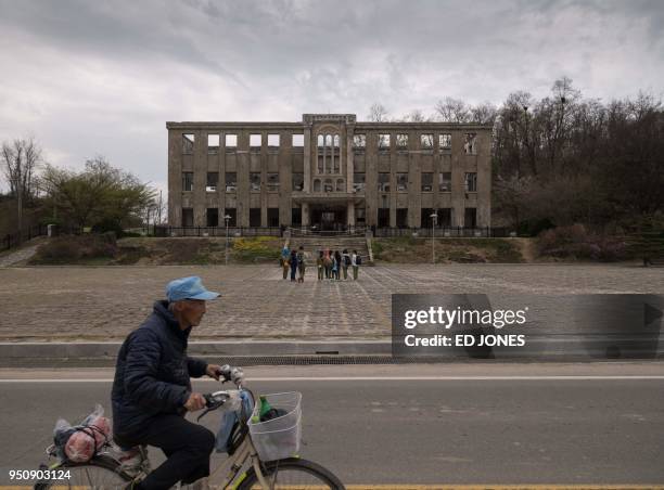 Photo taken on April 22, 2018 shows the former North Korean Workers Party Headquarters in Cheorwon. - When Kim Jong Un steps over the Military...