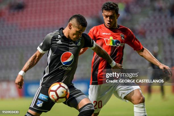 Colombia's Millonarios forward Ayron del Valle vies for the ball with Venezuela's Deportivo Lara defender Giacomo Di Giorgi, during their Copa...
