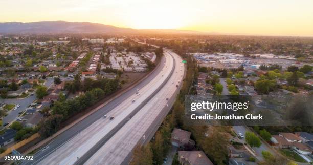 aerial of freeway in silicon valley at sunset. sunnyvale, usa - silicon valley stockfoto's en -beelden