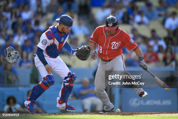 Moises Sierra of the Washington Nationals avoids a ball dropped by Yasmani Grandal of the Los Angeles Dodgers in the second inning at Dodger Stadium...