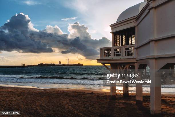 view of pavilion on la caleta beach, cadiz, spain - beach pavilion stock pictures, royalty-free photos & images