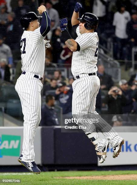 Gary Sanchez of the New York Yankees celebrates his two run home run with teamamte Giancarlo Stanton in the seventh inning against the Minnesota...