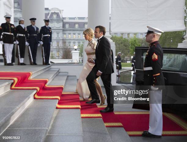 Emmanuel Macron, France's president, middle right, and Brigitte Macron, France's first lady, arrive to greet U.S. President Donald Trump and U.S....