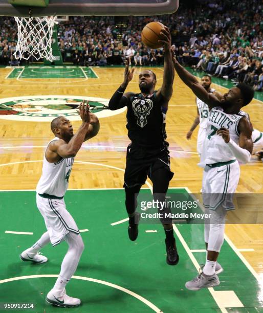 Shabazz Muhammad of the Milwaukee Bucks takes a shot against Jaylen Brown of the Boston Celtics and Al Horford during Game Five in Round One of the...