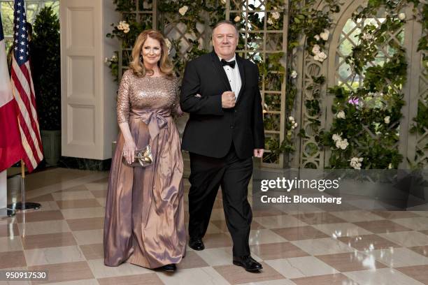 Mike Pompeo, director of the Central Intelligence Agency , right, and Susan Pompeo arrive for a state dinner in honor of French President Emanuel...