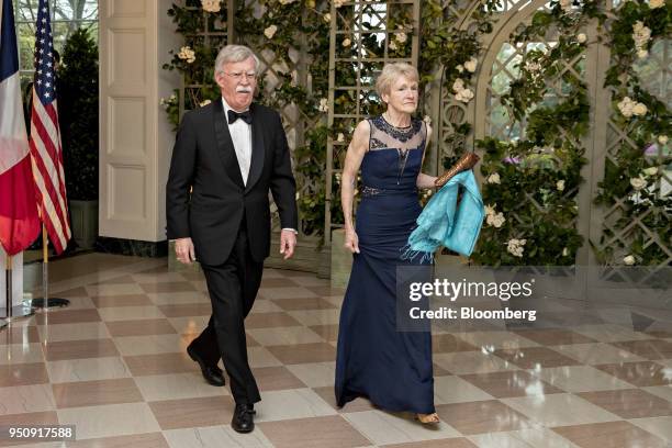 John Bolton, national security advisor, left, and Gretchen Bolton arrive for a state dinner in honor of French President Emanuel Macron at the White...