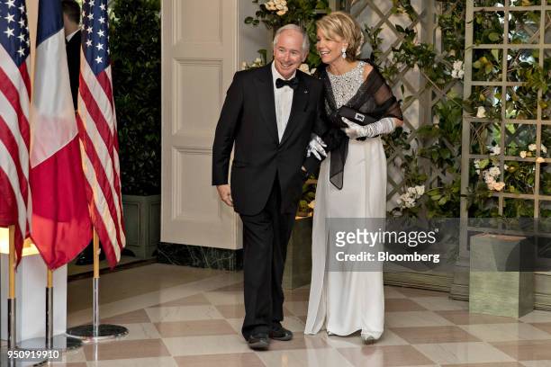 Stephen Schwarzman, co-founder, chairman and chief executive officer of Blackstone Group LP, left, and Christine Schwarzman arrive for a state dinner...