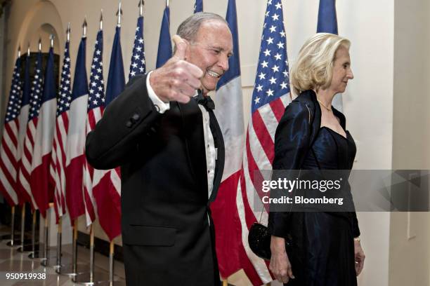 Larry Kudlow, director of the U.S. National Economic Council, left, and gives a thumbs-up as he and Judith Kudlow arrive for a state dinner in honor...