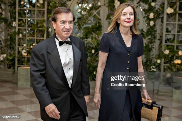 Representative Ed Royce, and Republican from California, left, and Maria Royce arrive for a state dinner in honor of French President Emanuel Macron...