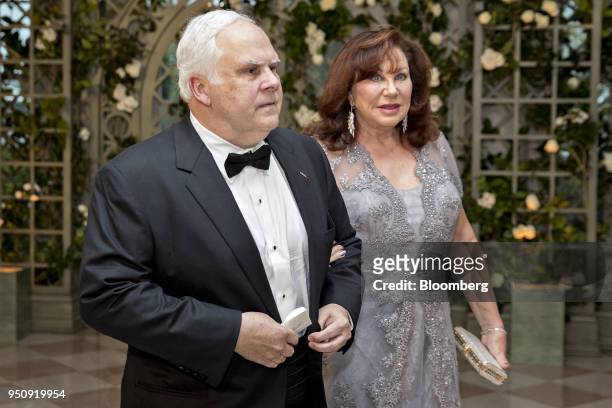 Fred Smith, president and chief executive officer of FedEx Corp., left, and Diane Smith arrive for a state dinner in honor of French President...