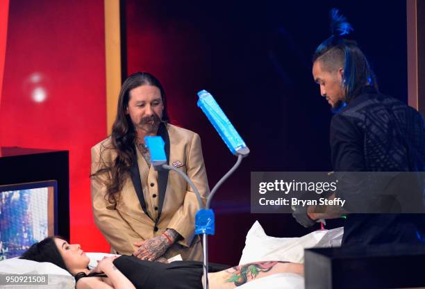 Judge Oliver Peck observes as Anthony Michaels competes during the Ink Master Season 10 Finale at the Park Theater at Monte Carlo Resort and Casino...