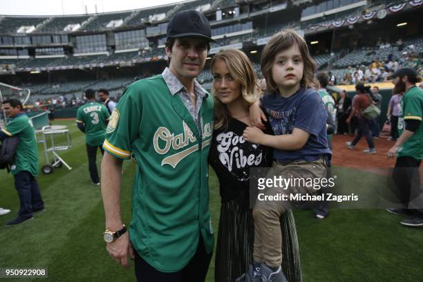 Barry Zito stand on the field with his wife Amber and son prior to a pregame ceremony honoring the Oakland Athletics 50th Anniversary Team prior to...