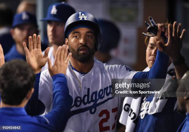 Los Angeles Dodgers Outfield Matt Kemp is congratulated by his team mates after being batted in for a run during a Major League Baseball game between...