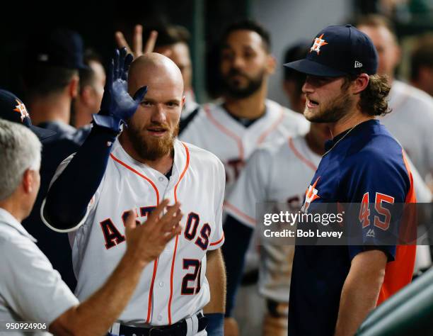 Derek Fisher of the Houston Astros hits a home run in the fifth inning against the Los Angeles Angels of Anaheim at Minute Maid Park on April 24,...