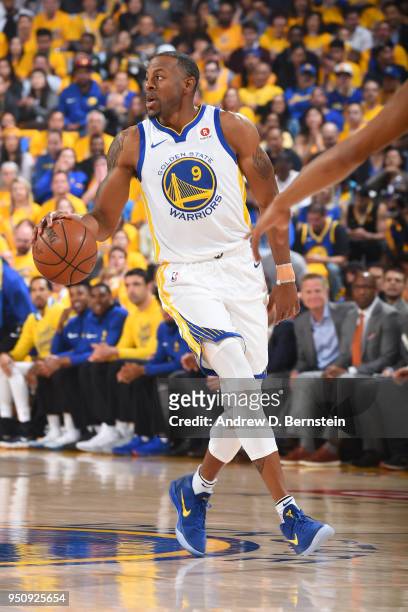 Andre Iguodala of the Golden State Warriors handles the ball against the San Antonio Spurs in Game Five of Round One of the 2018 NBA Playoffs on...
