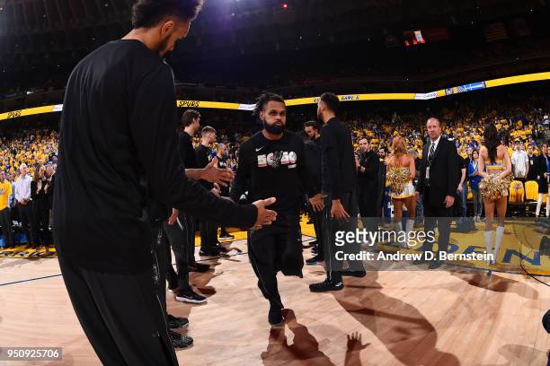 Patty Mills of the San Antonio Spurs high fives his teammates before the game against the Golden State Warriors in Game Five of Round One of the 2018...