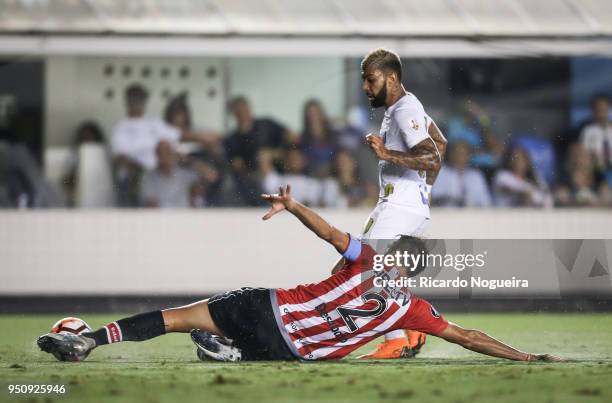 Gabriel#10 of Santos battles for the ball with Desabato of Estudiantes during the match between Santos and Estudiantes as a part of Copa Libertadores...