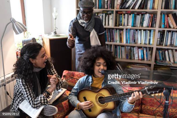 singing with friends at home - music rehearsal stock pictures, royalty-free photos & images