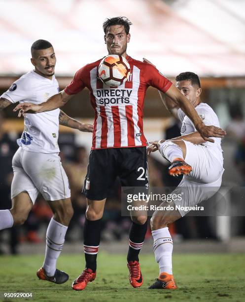 Jean Mota#3 of Santos battles for the ball with Brona of Estudiantes during the match between Santos and Estudiantes as a part of Copa Libertadores...