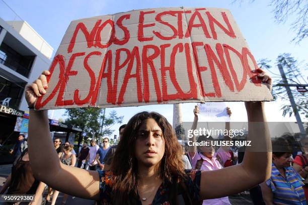 Mexican students take part in a protest against the violence in Mexico and the murder of three students from the University of Audiovisual Media of...