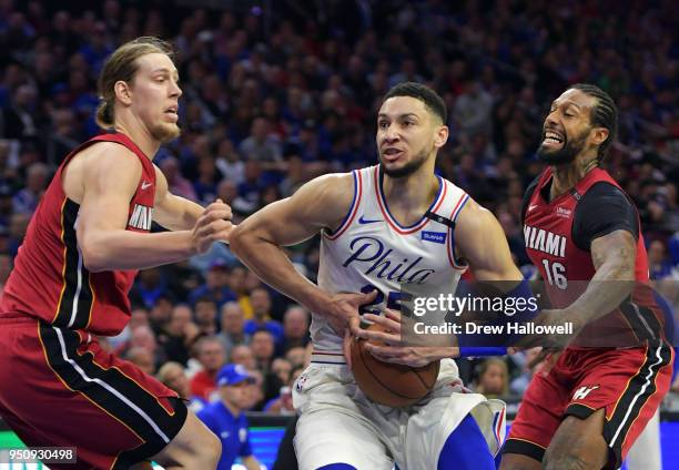 Ben Simmons of the Philadelphia 76ers fights through Kelly Olynyk and James Johnson of the Miami Heat at Wells Fargo Center on April 24, 2018 in...