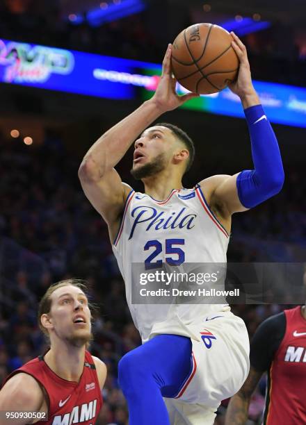 Ben Simmons of the Philadelphia 76ers goes up for a layup past Kelly Olynyk of the Miami Heat at Wells Fargo Center on April 24, 2018 in...